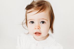 one year old girl with brown eyes and brown hair